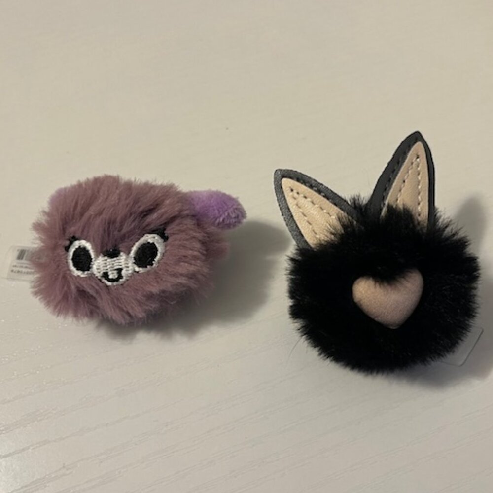 2 Furry Crocs charms/jibbitz - black puff cat and purple puff character